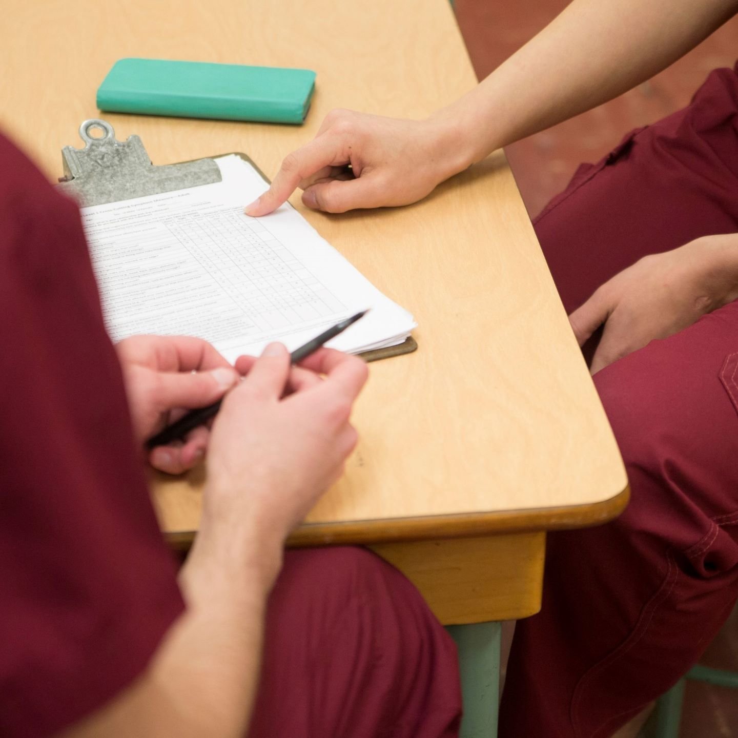a pair of people sitting at a table