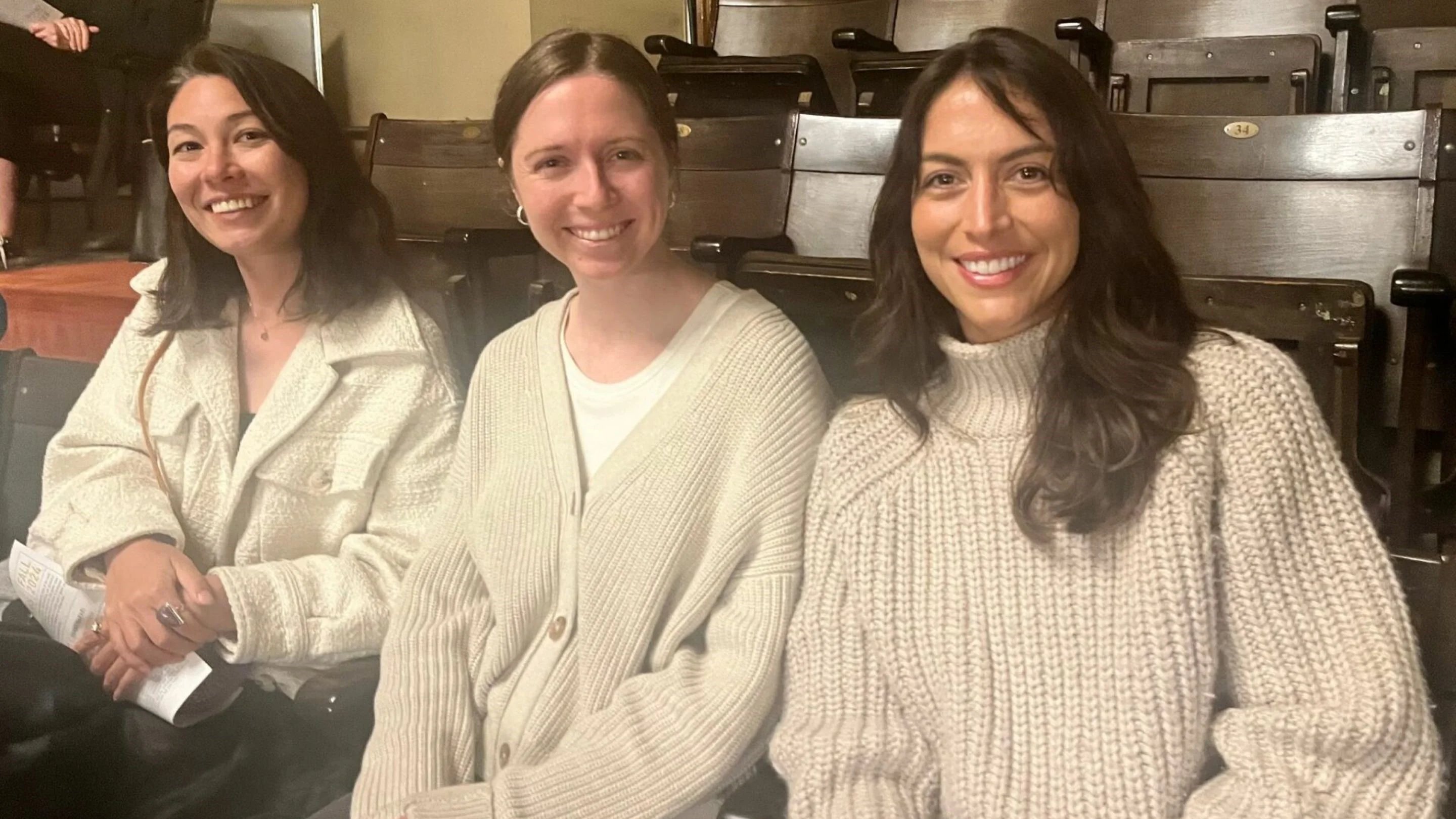 a group of women sitting in chairs