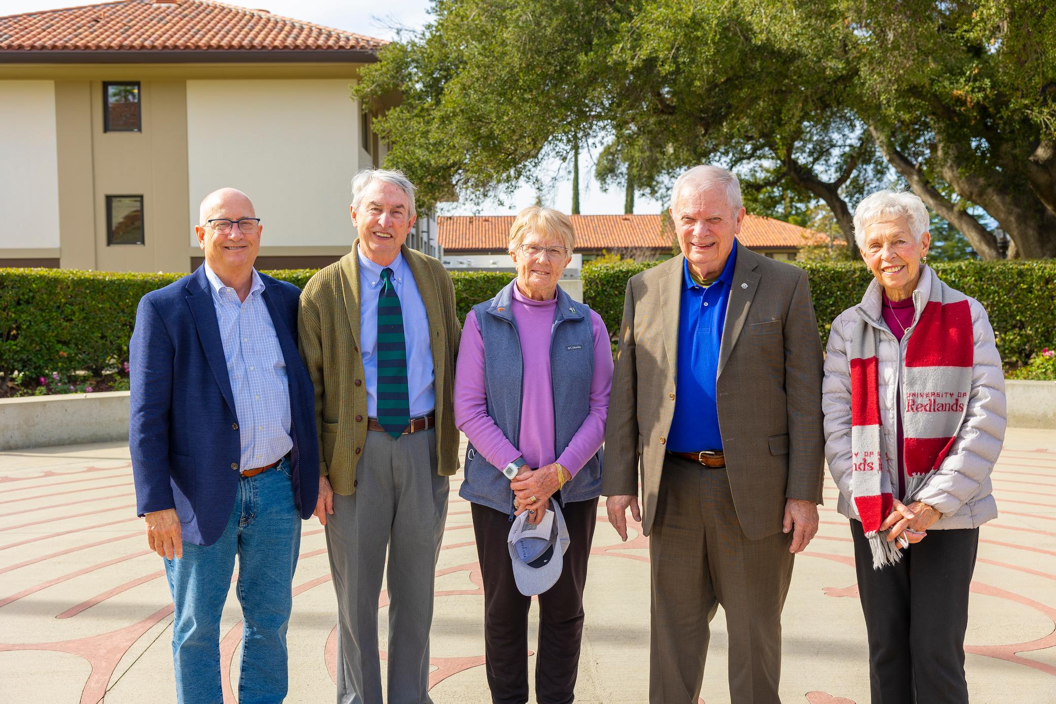 a group of old people standing outside