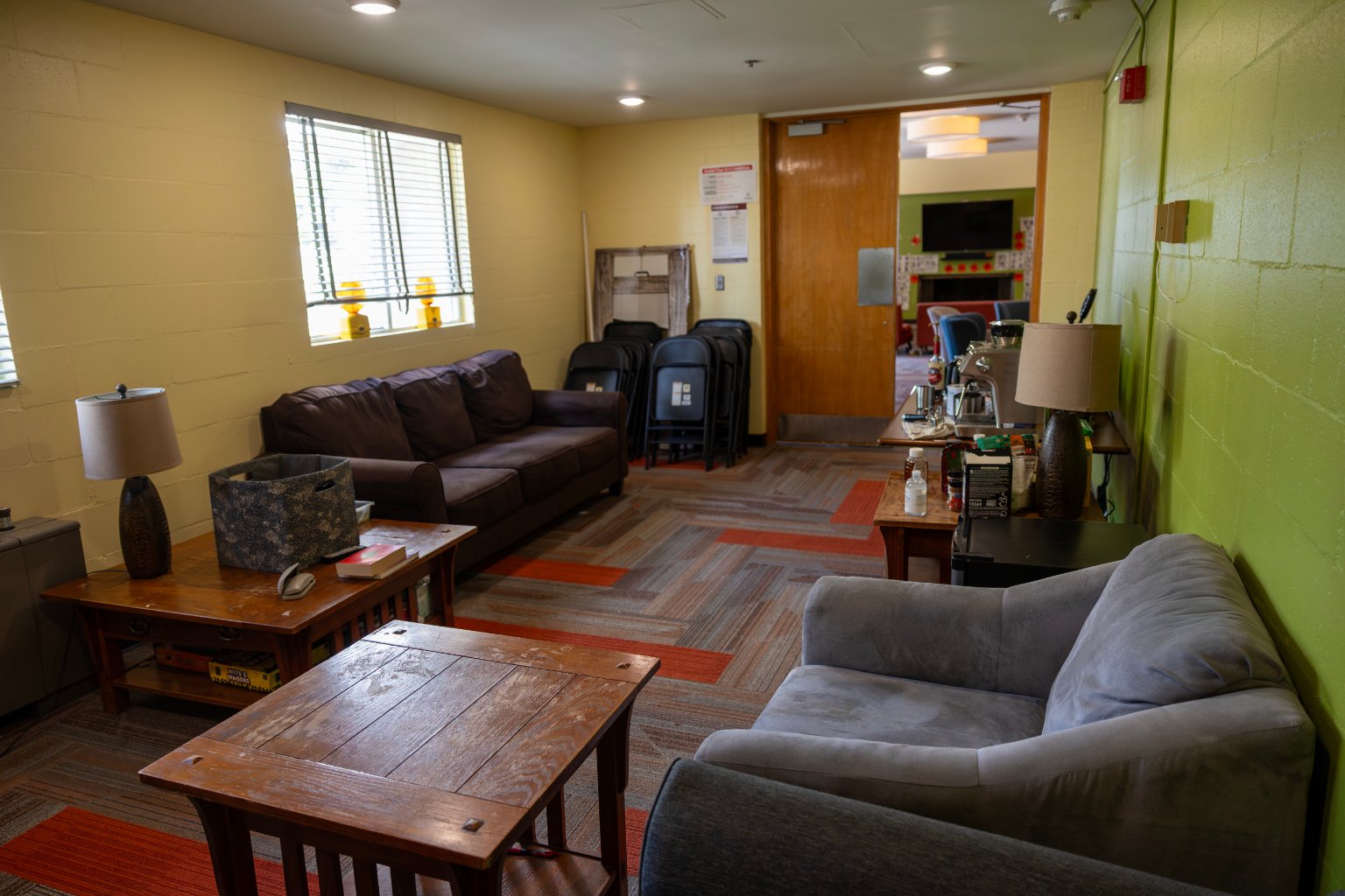 a room with couches and coffee tables
