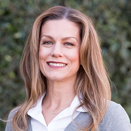 a woman smiling at the camera