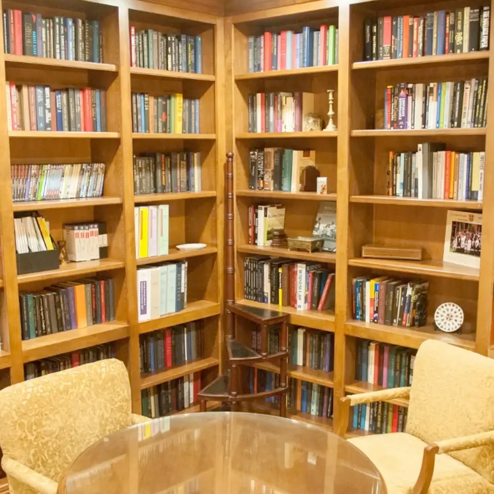 a room with bookshelves and a table