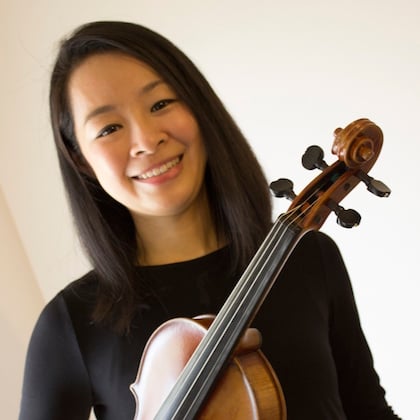 a person holding a violin