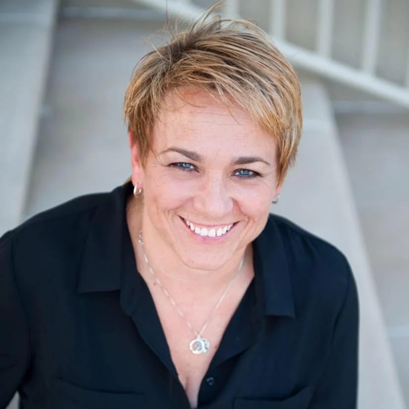 a woman smiling at the camera