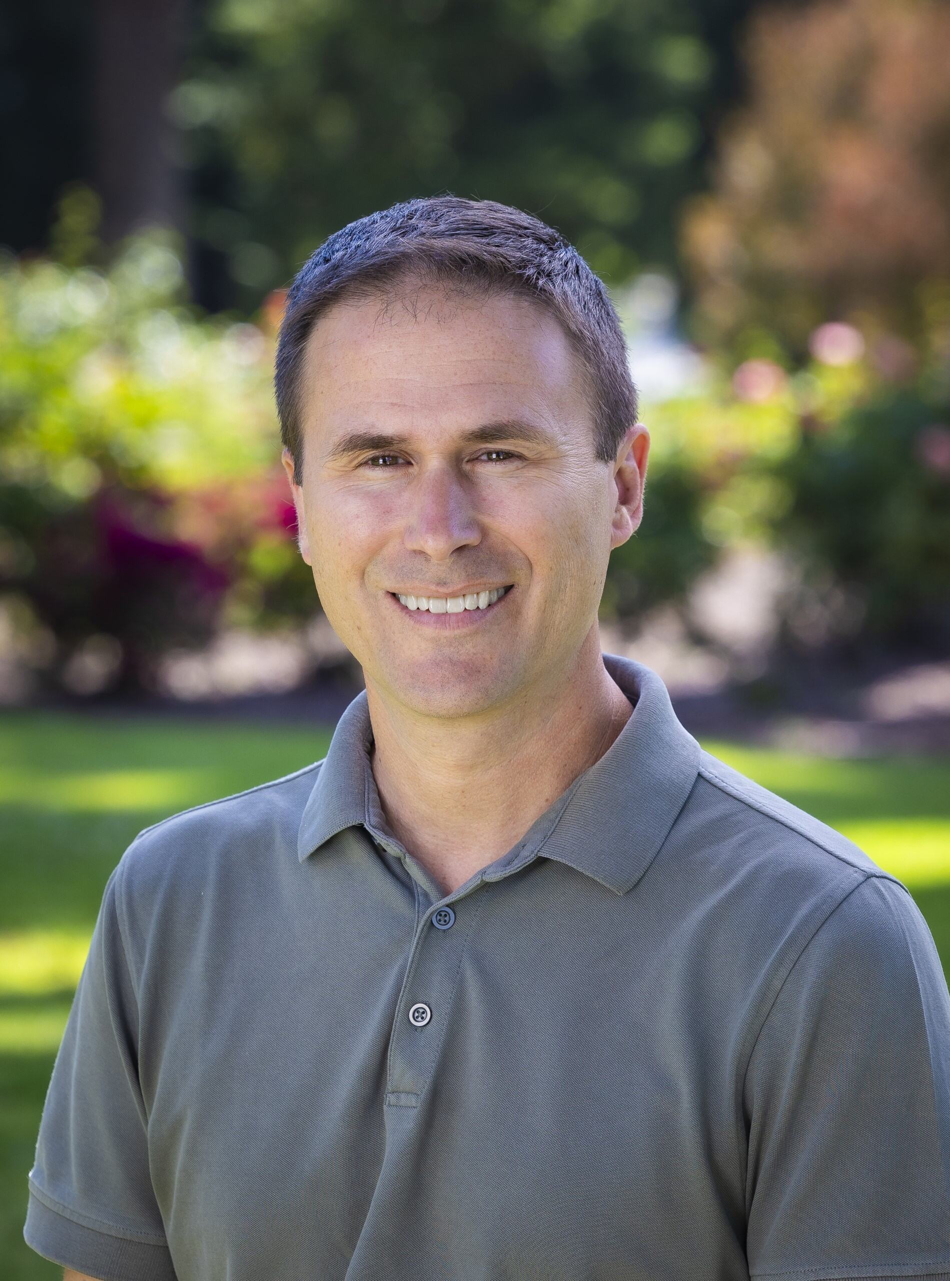 a man smiling at the camera