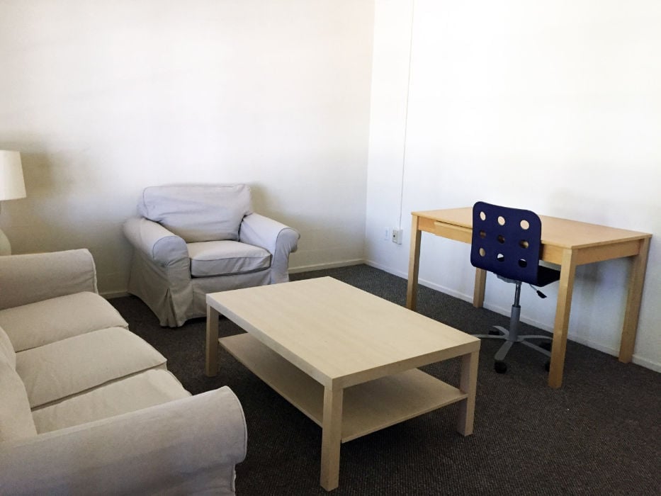 a room with a table and chairs