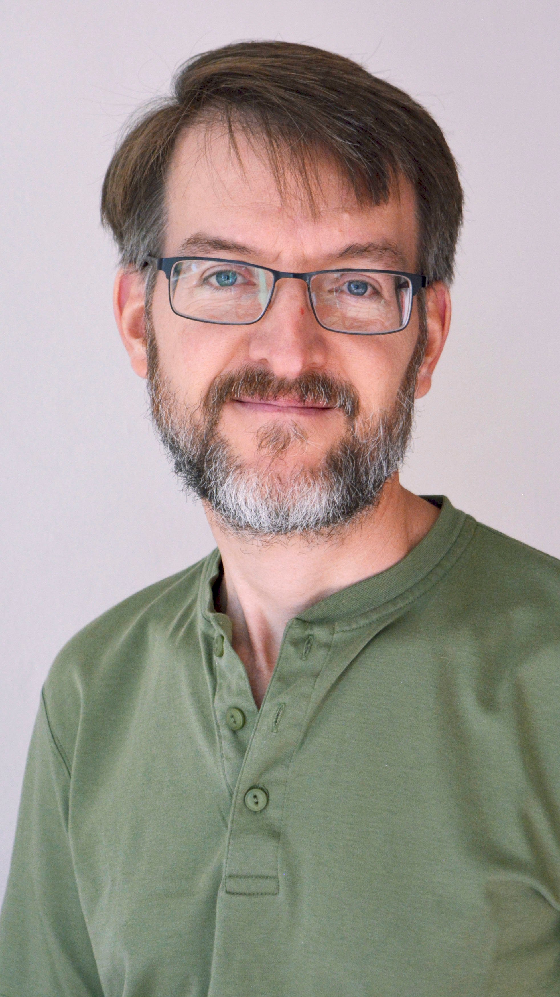 a man with glasses and a beard