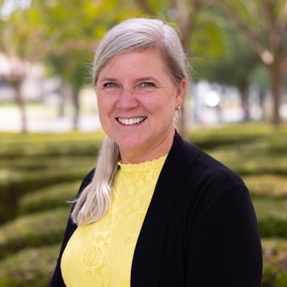 a woman smiling at camera