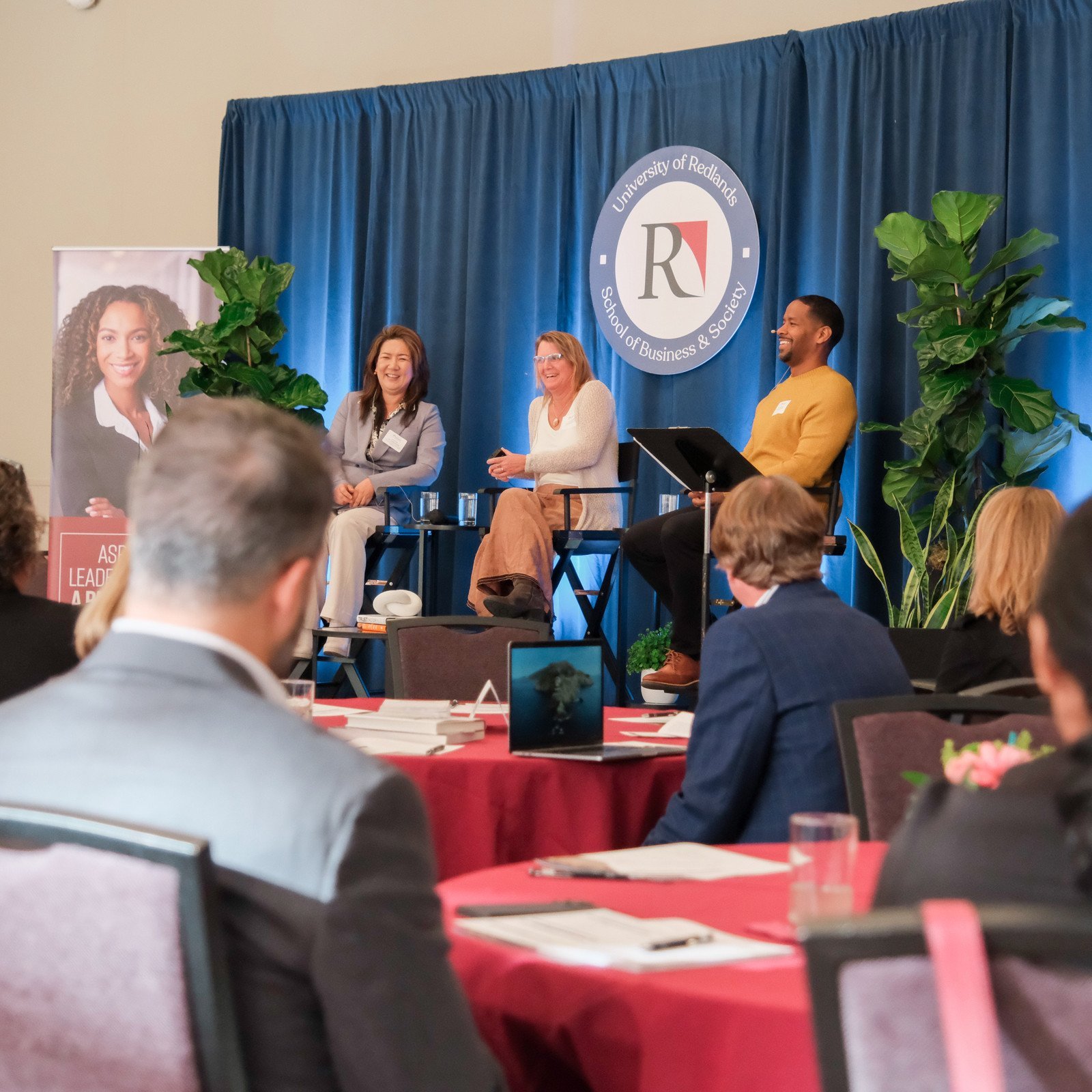a group of people sitting on a stage