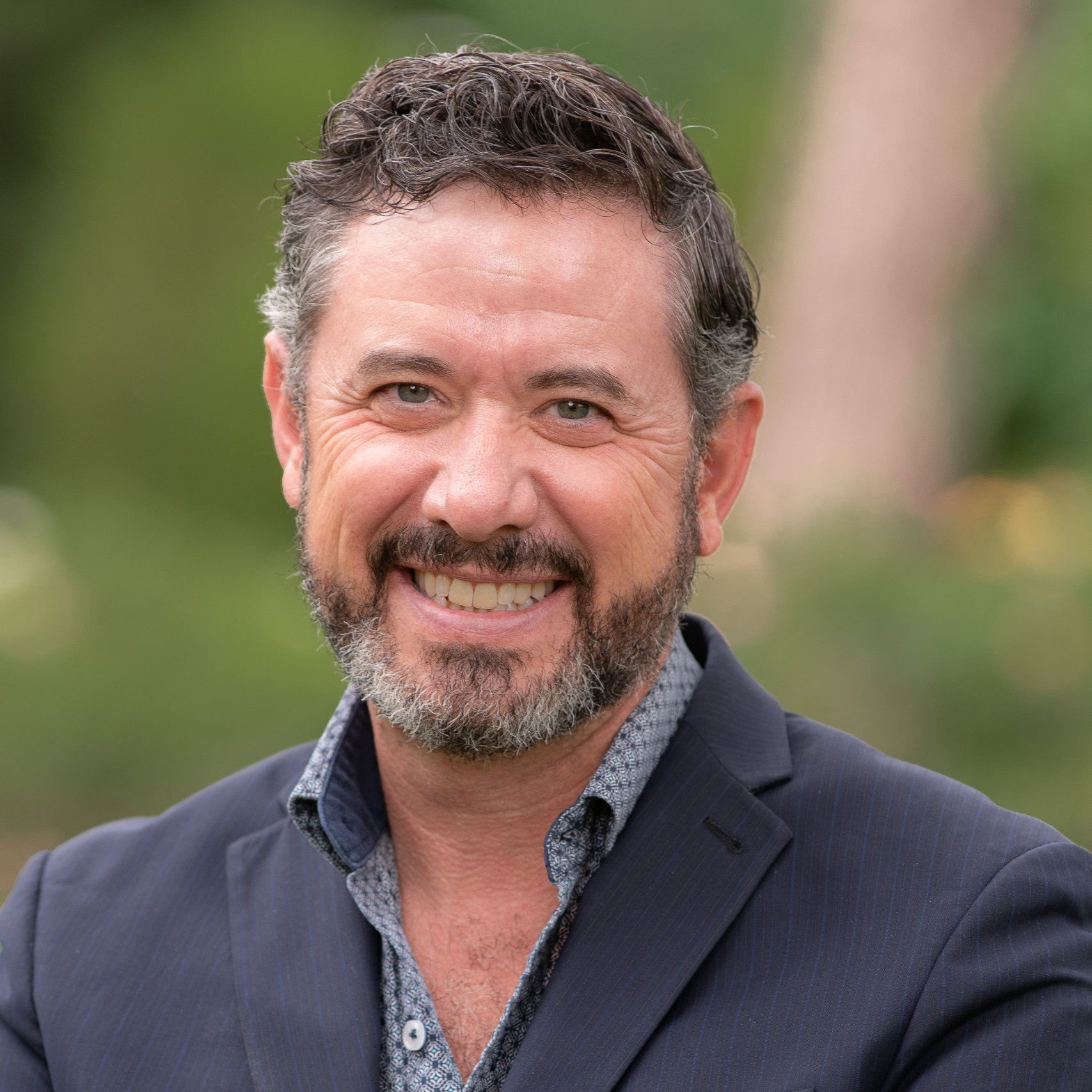 a man smiling for the camera