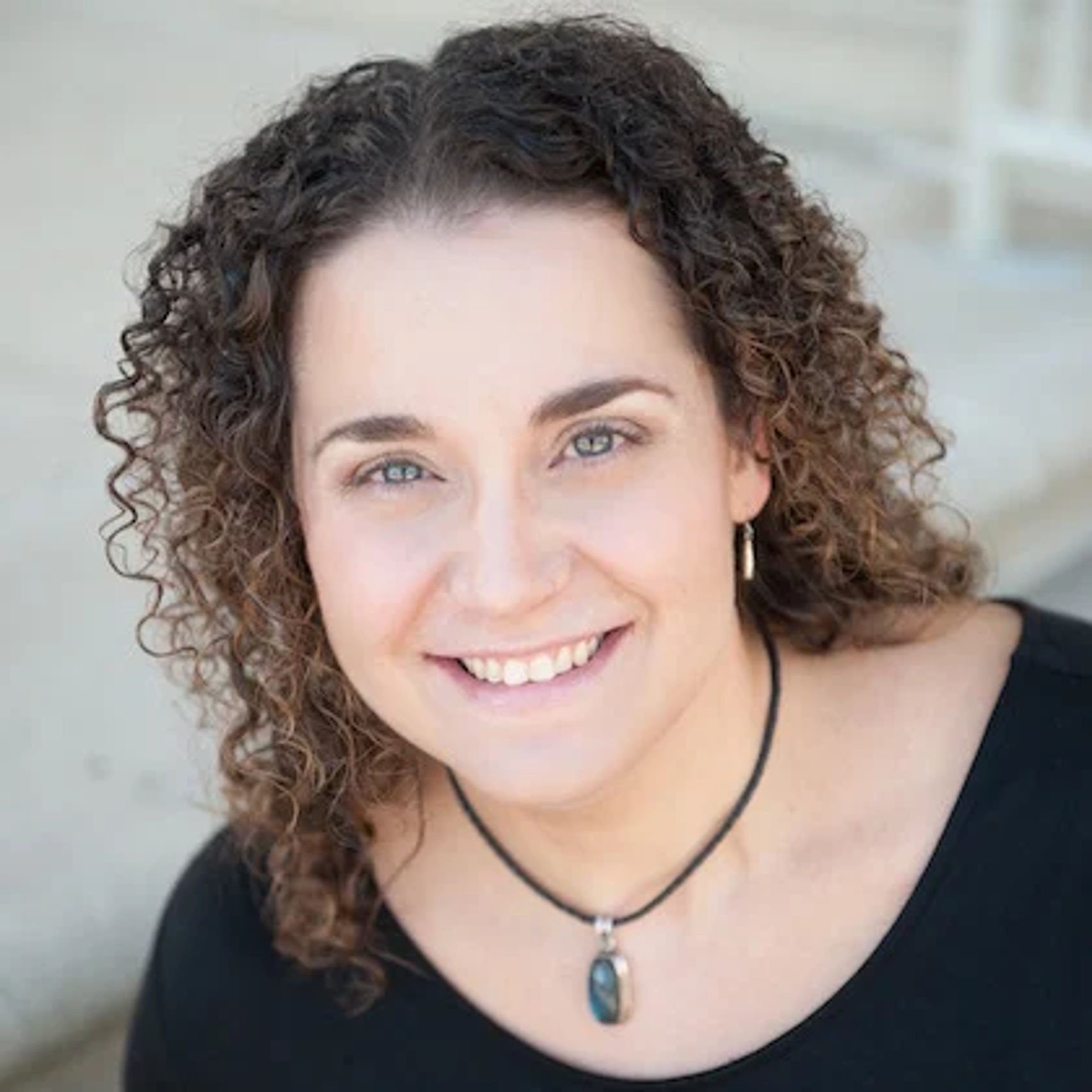 a woman smiling at camera