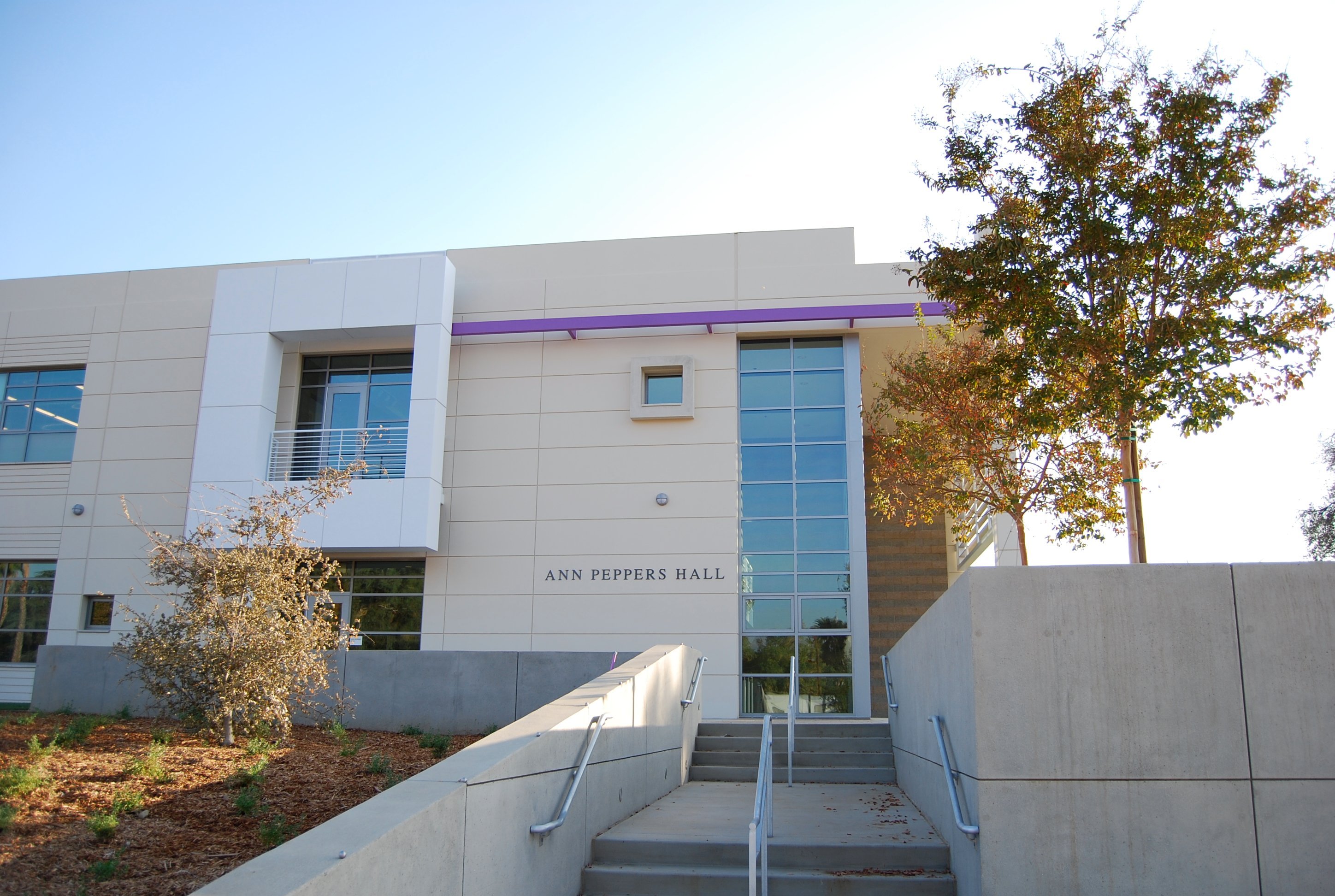 a building with stairs leading to the entrance