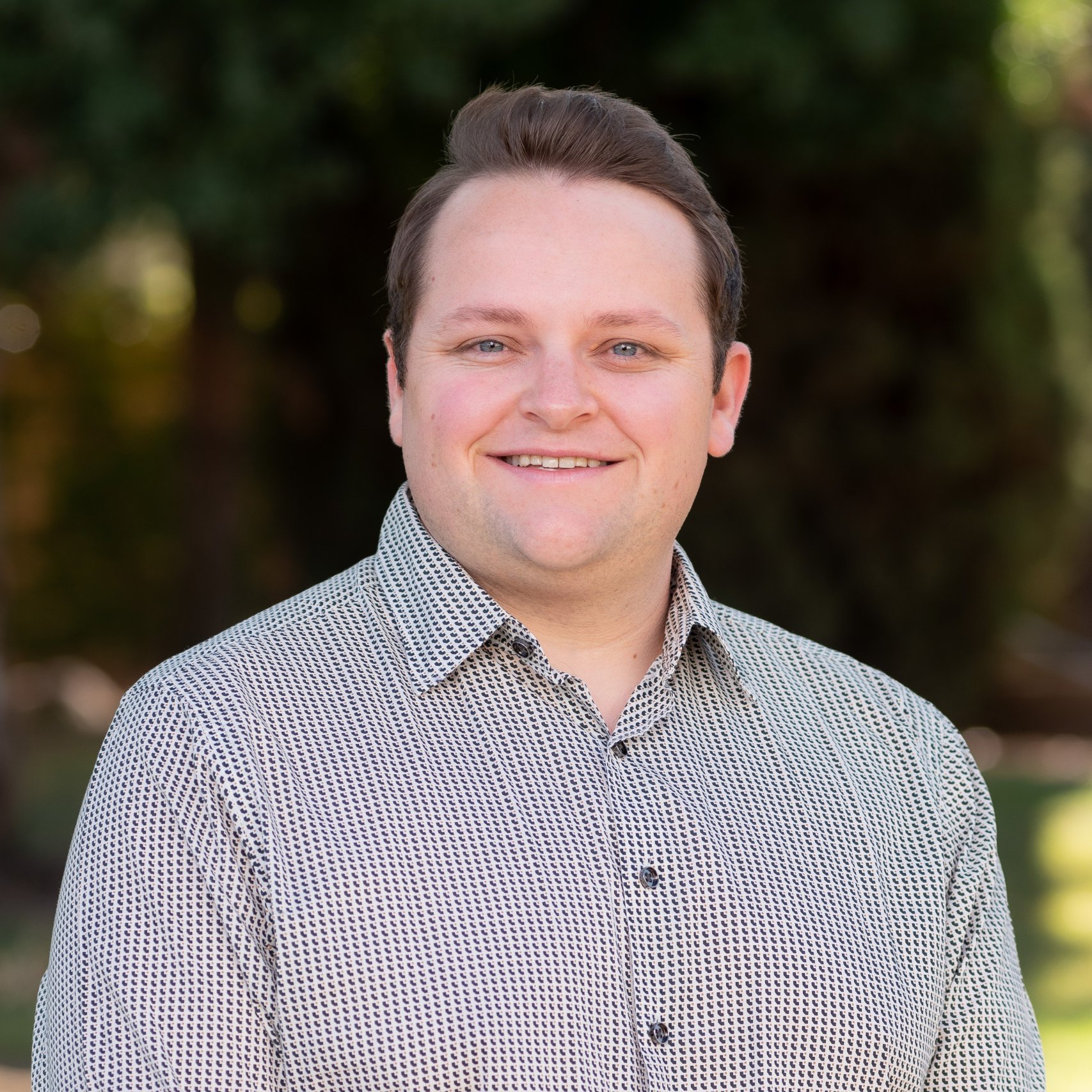 a man smiling for a picture
