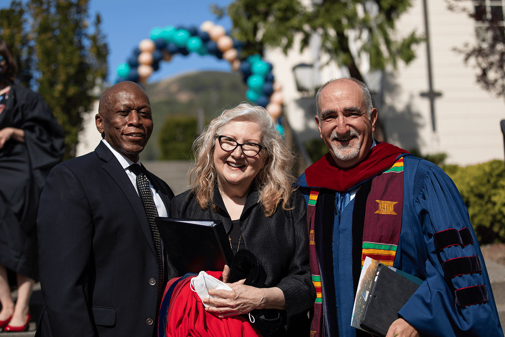 a group of people posing for a photo
