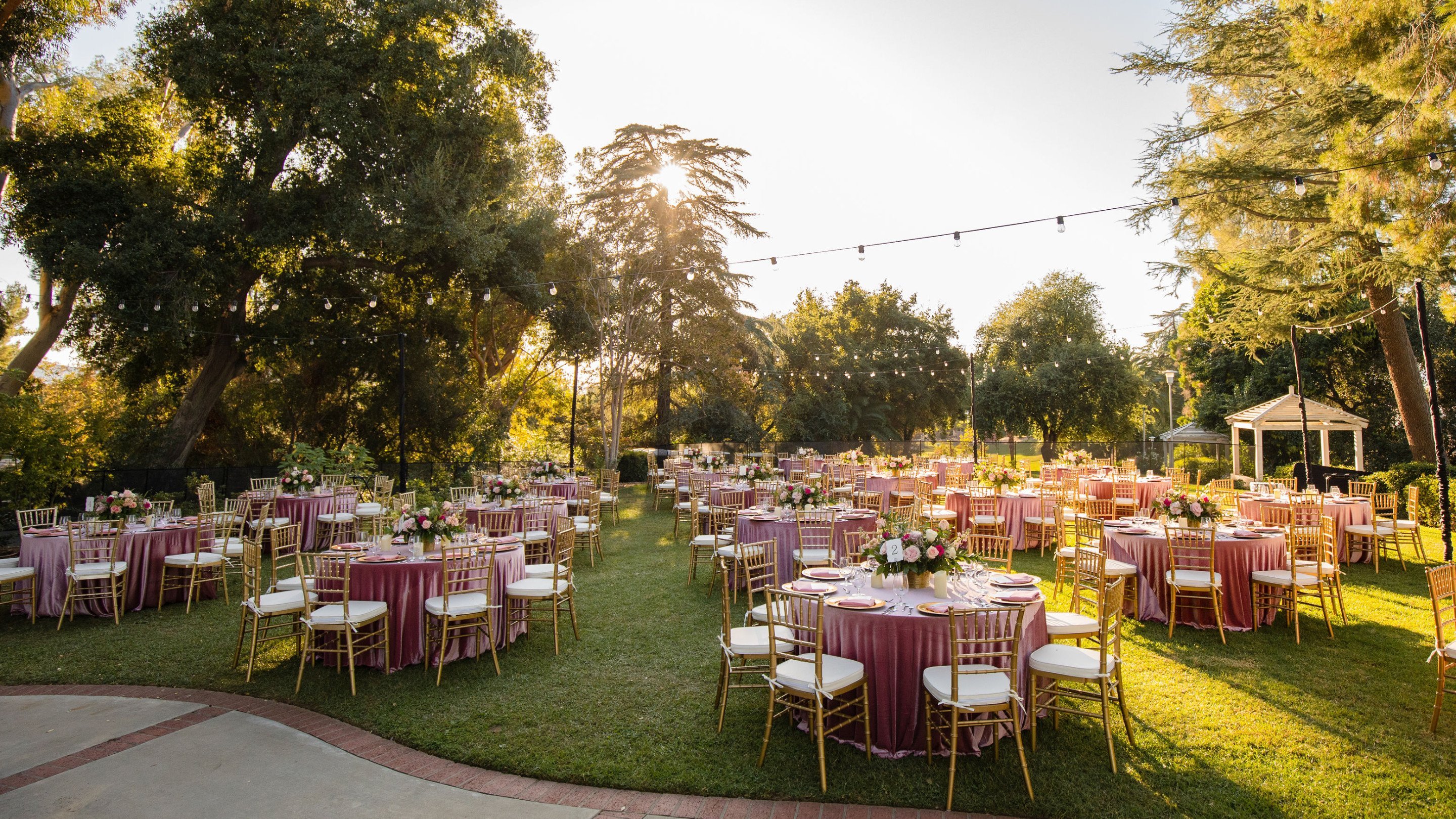 a group of tables set up in a garden