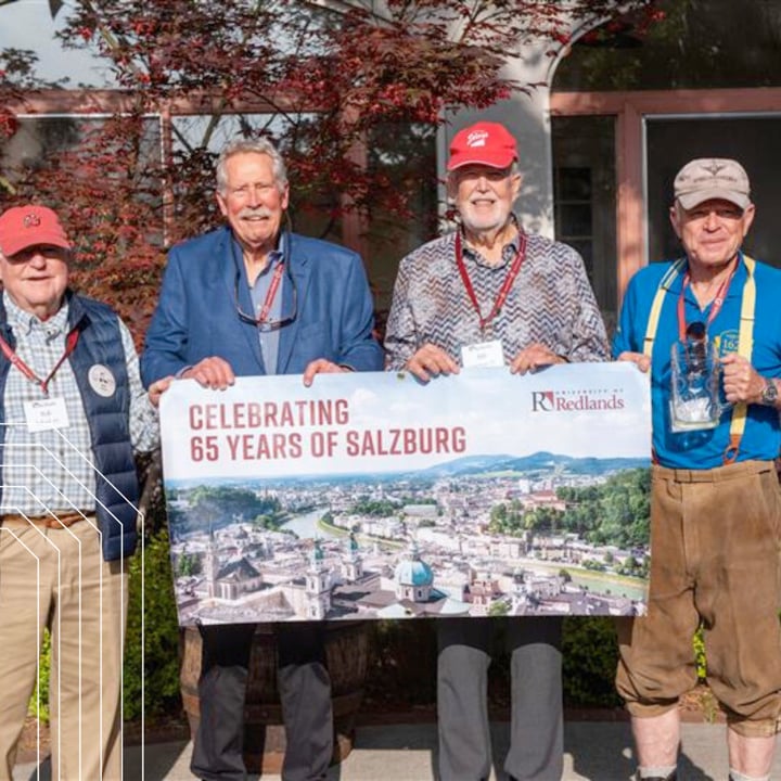a group of men holding a banner