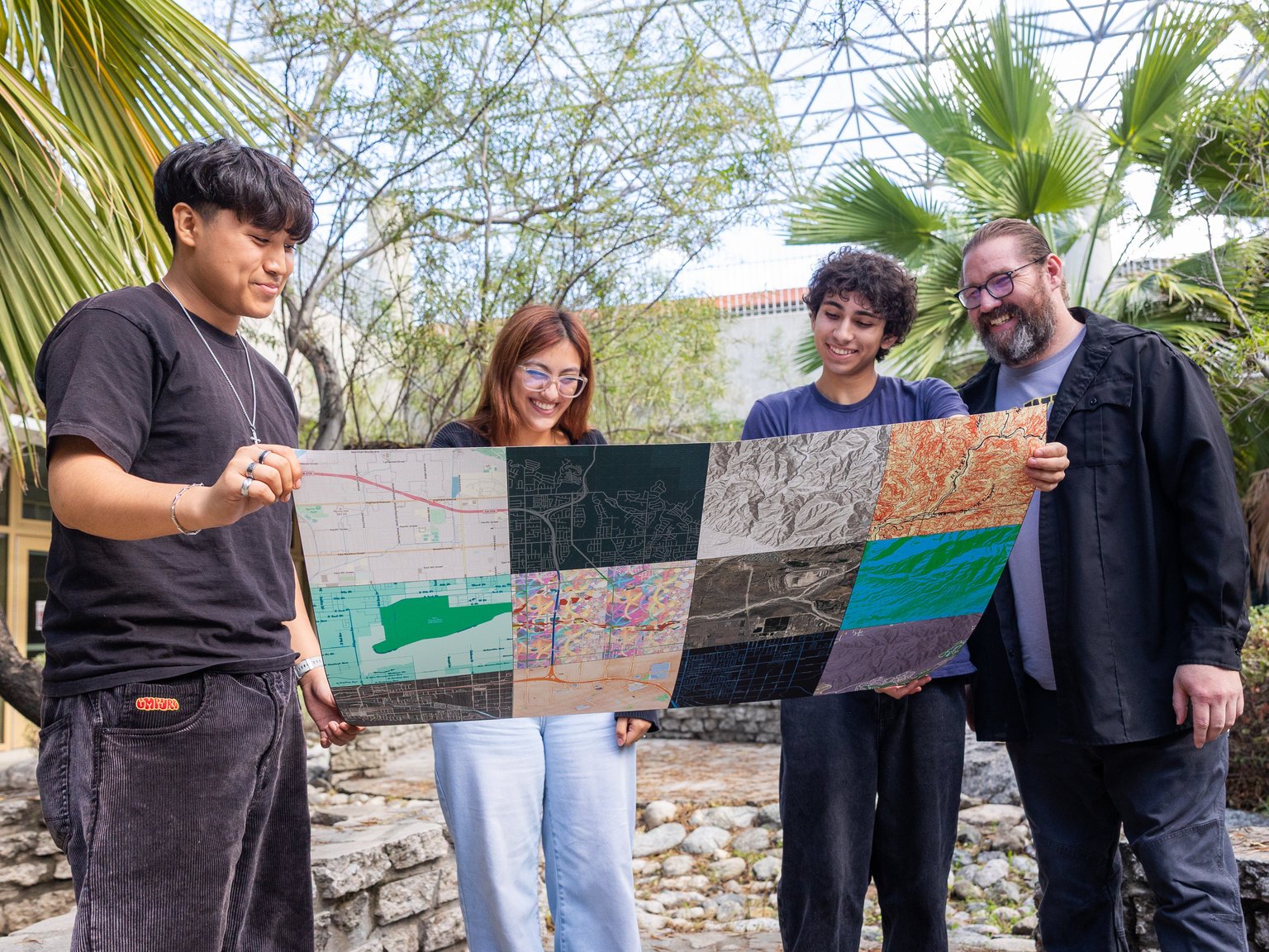 a group of people holding a map