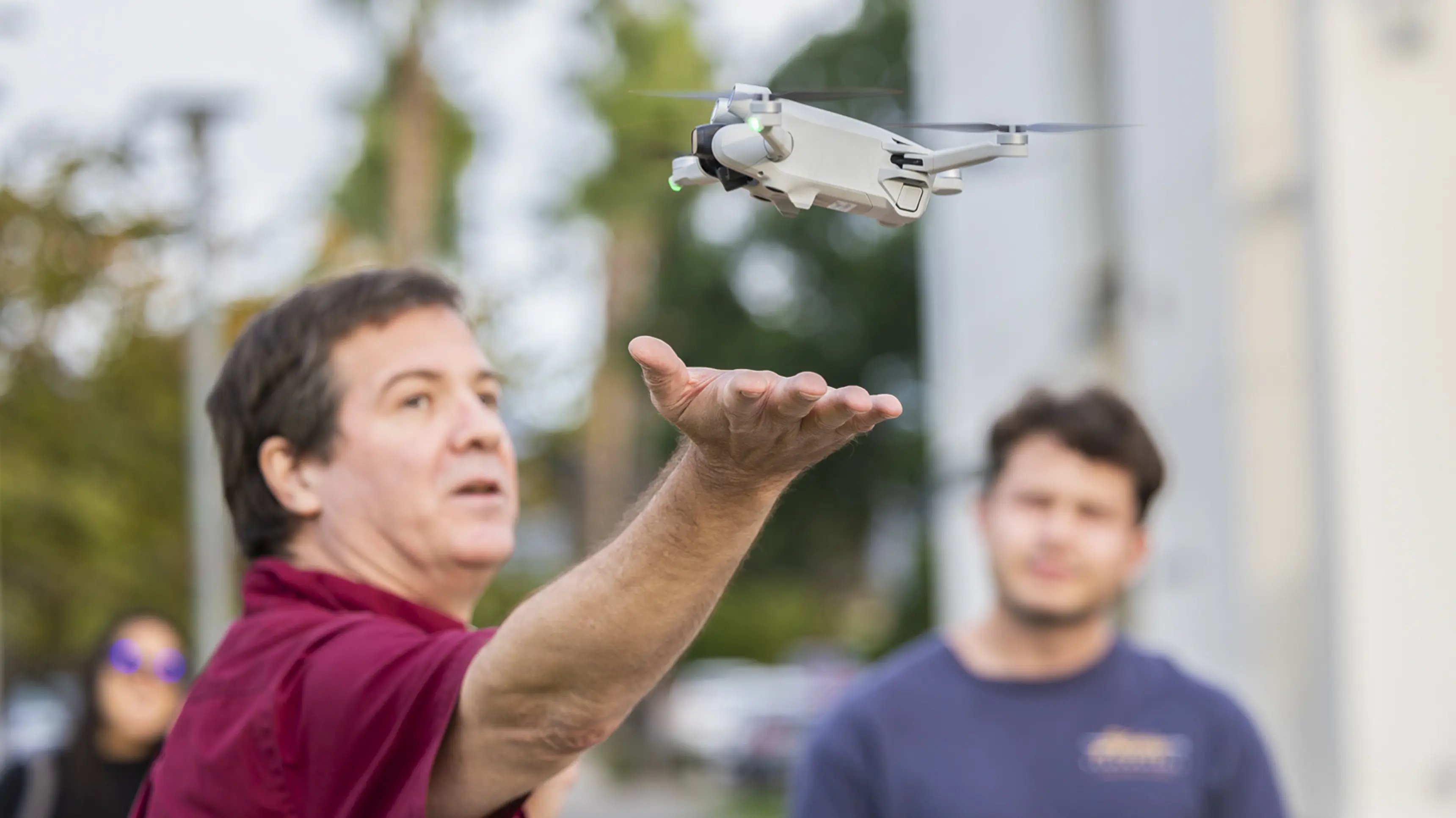 a man holding a drone