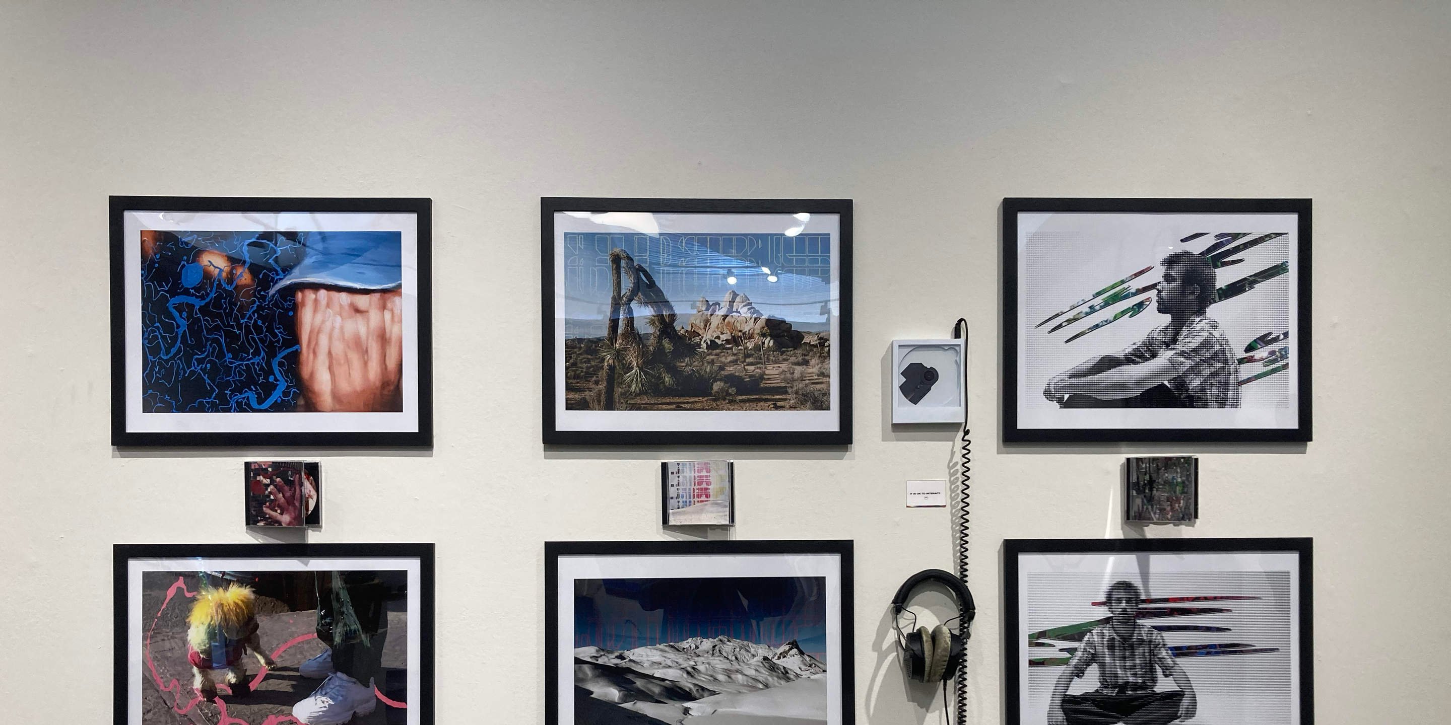 a wall with pictures and objects on it