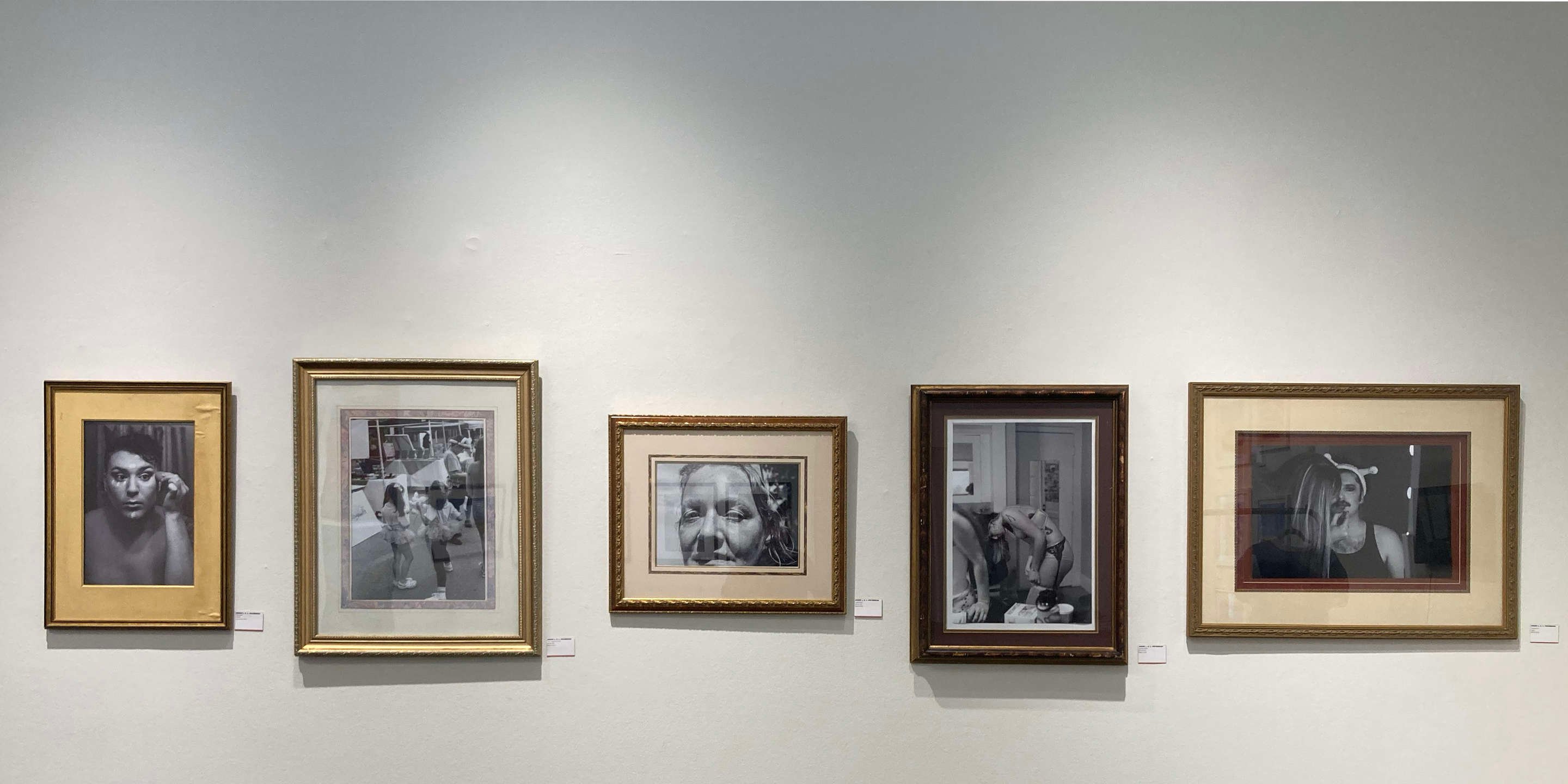 a group of framed pictures on a wall