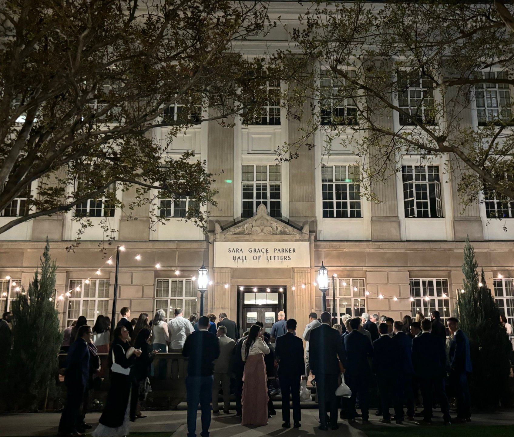 a group of people outside of a building