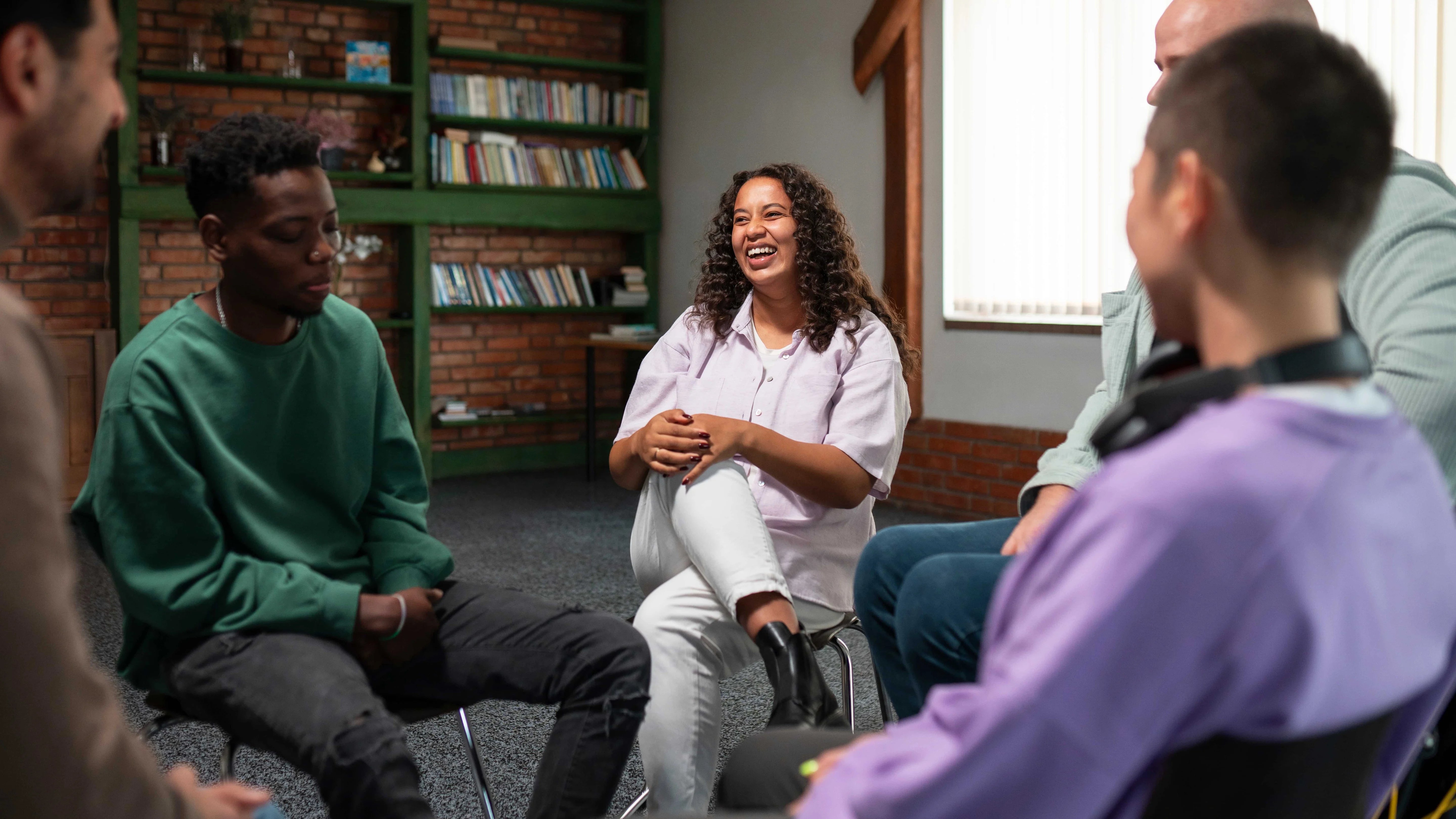 a group of people sitting in a circle