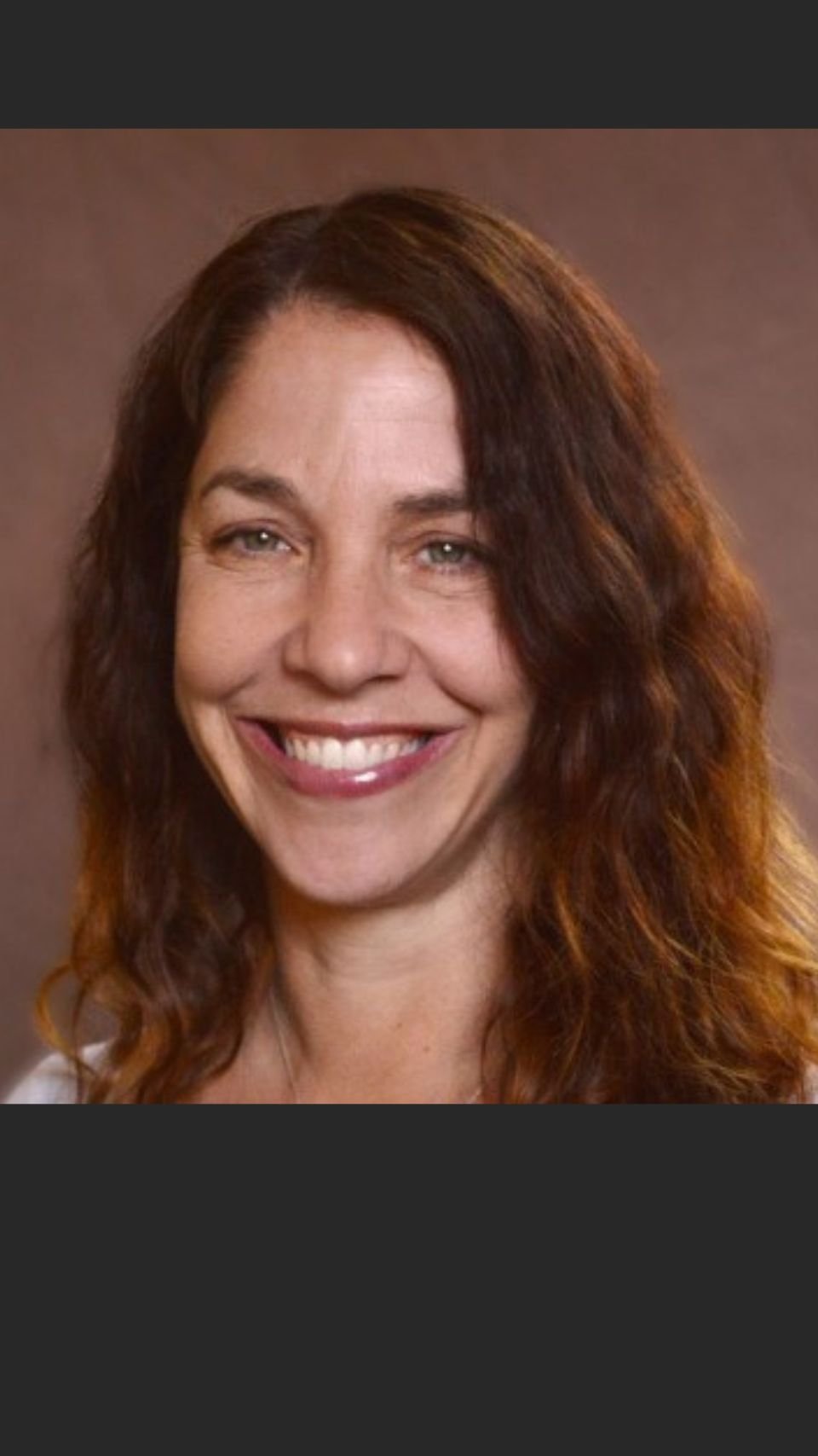 a close-up of a woman smiling