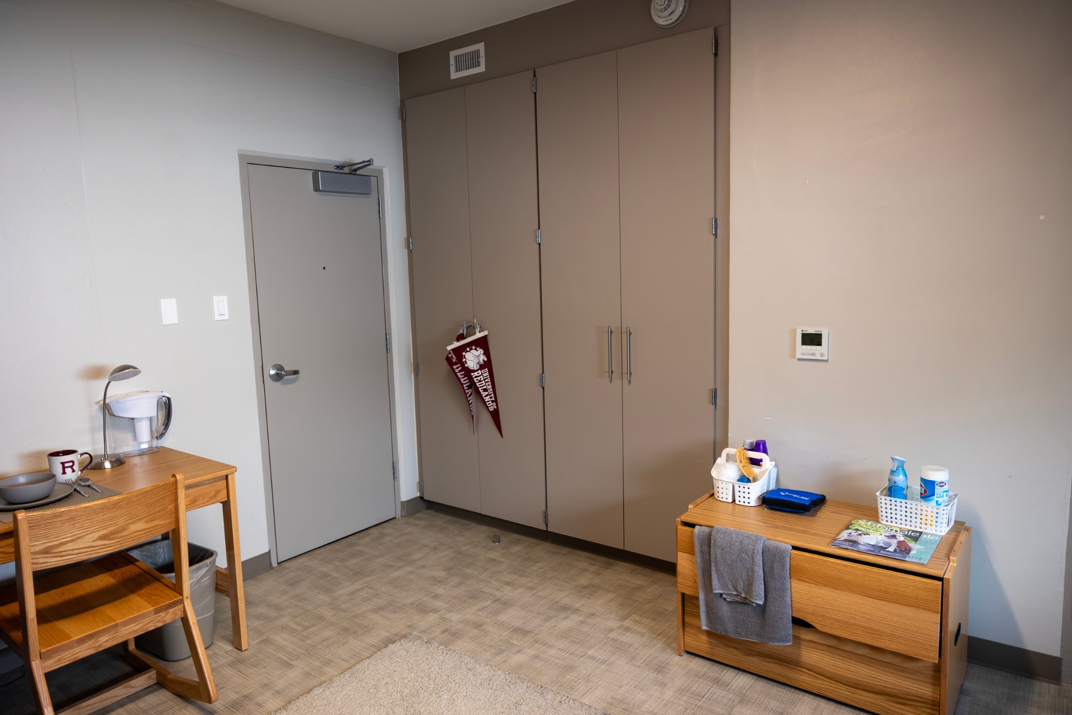 a room with a door and a cupboard