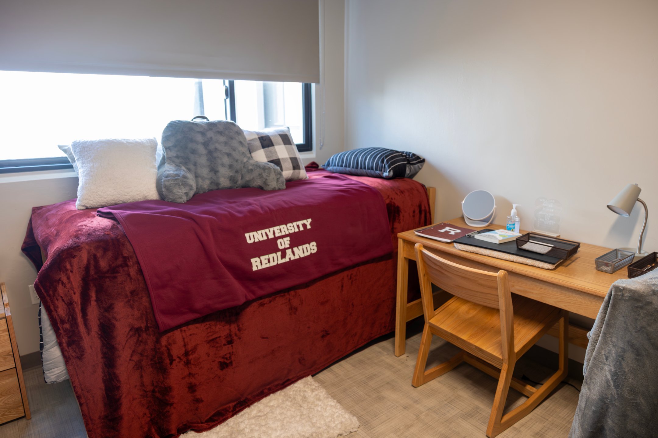 a bed with a stuffed animal on it