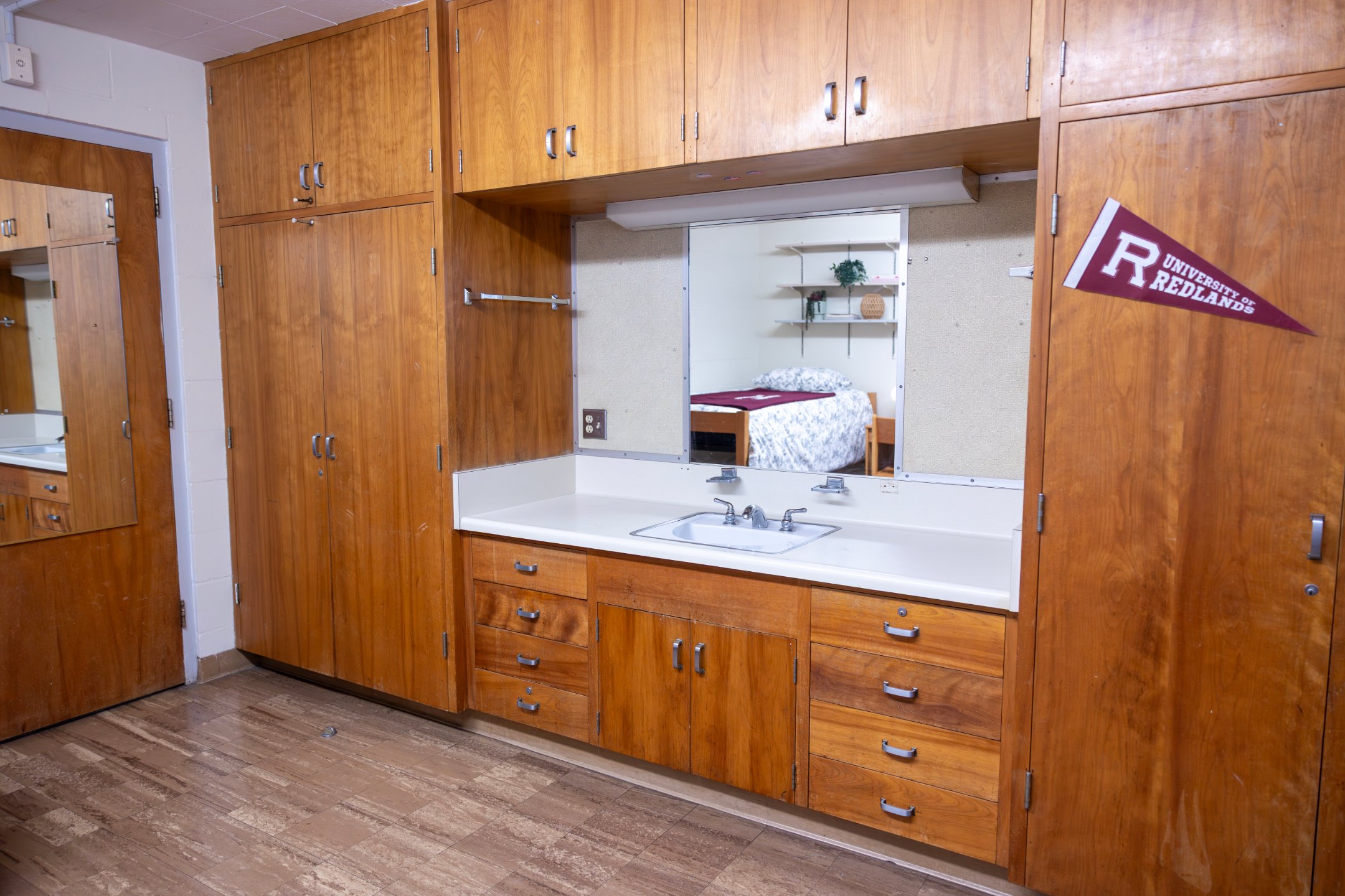 a room with a sink and cabinets