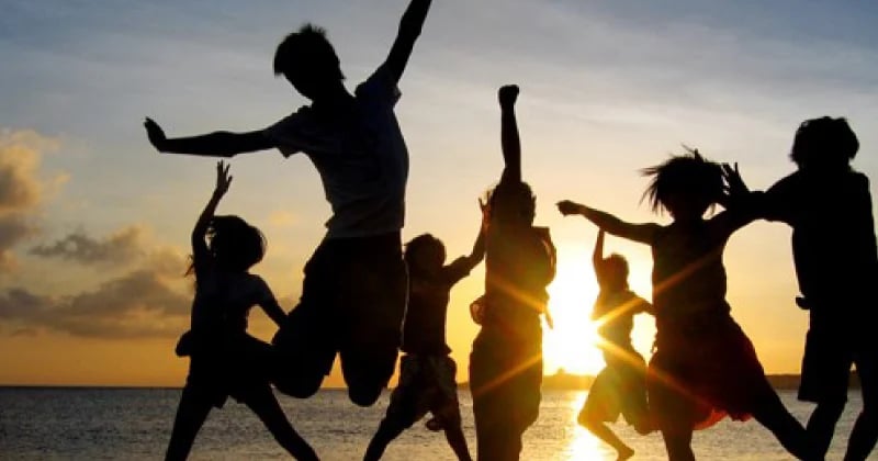 a group of people jumping in the air