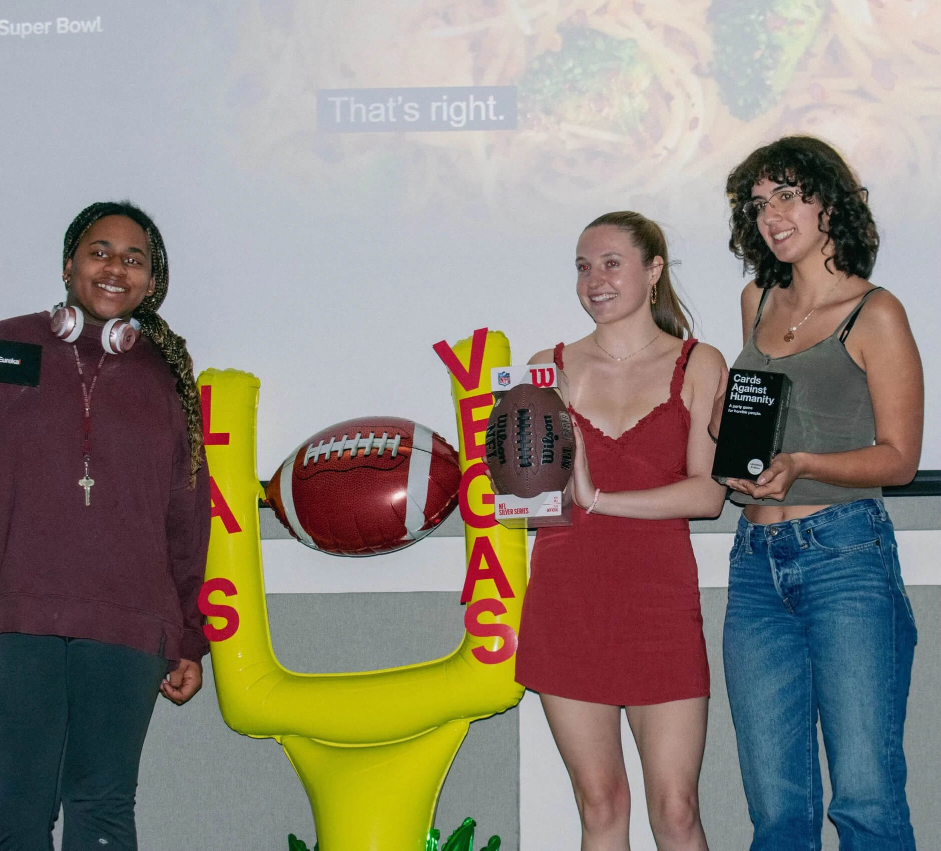a group of women posing for a photo