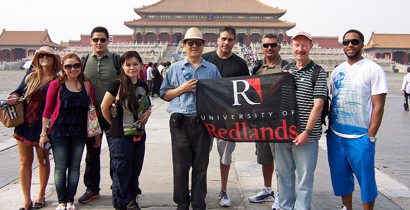 a group of people holding a banner