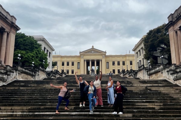 a group of people posing for a picture on a staircase