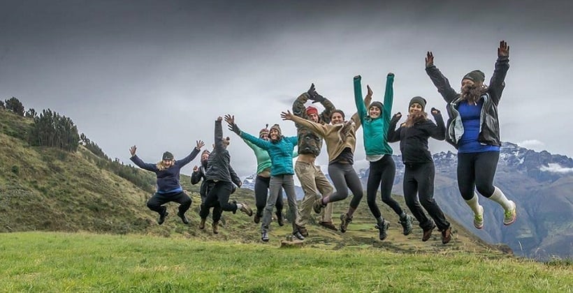 a group of people jumping in the air