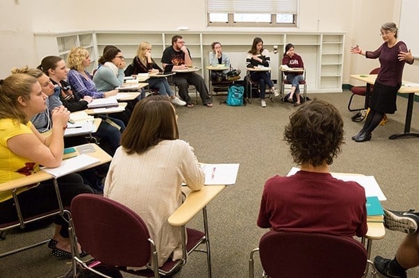 a man standing in front of a group of students