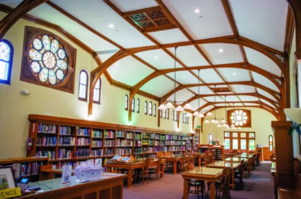 a library with tables and books