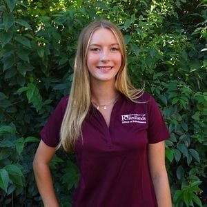 a woman in a maroon shirt
