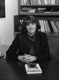 a woman sitting at a table