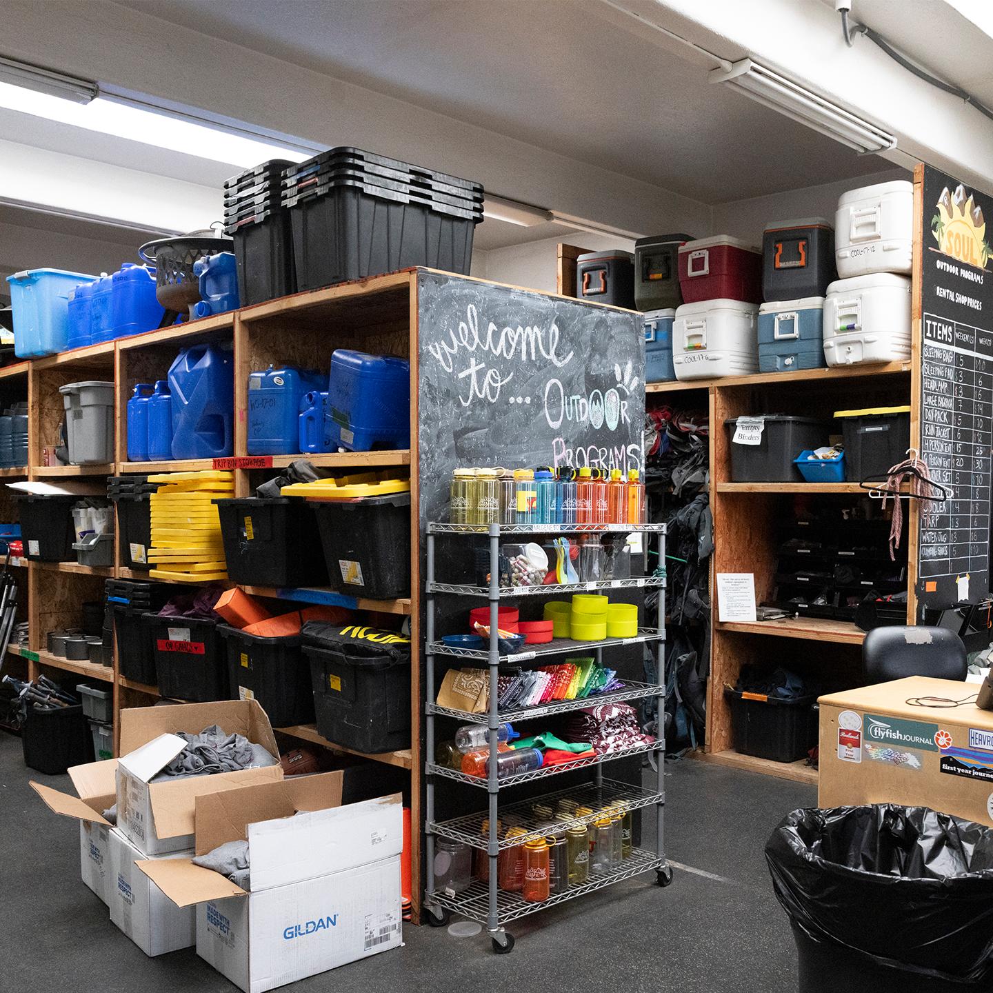 a room with shelves and bins