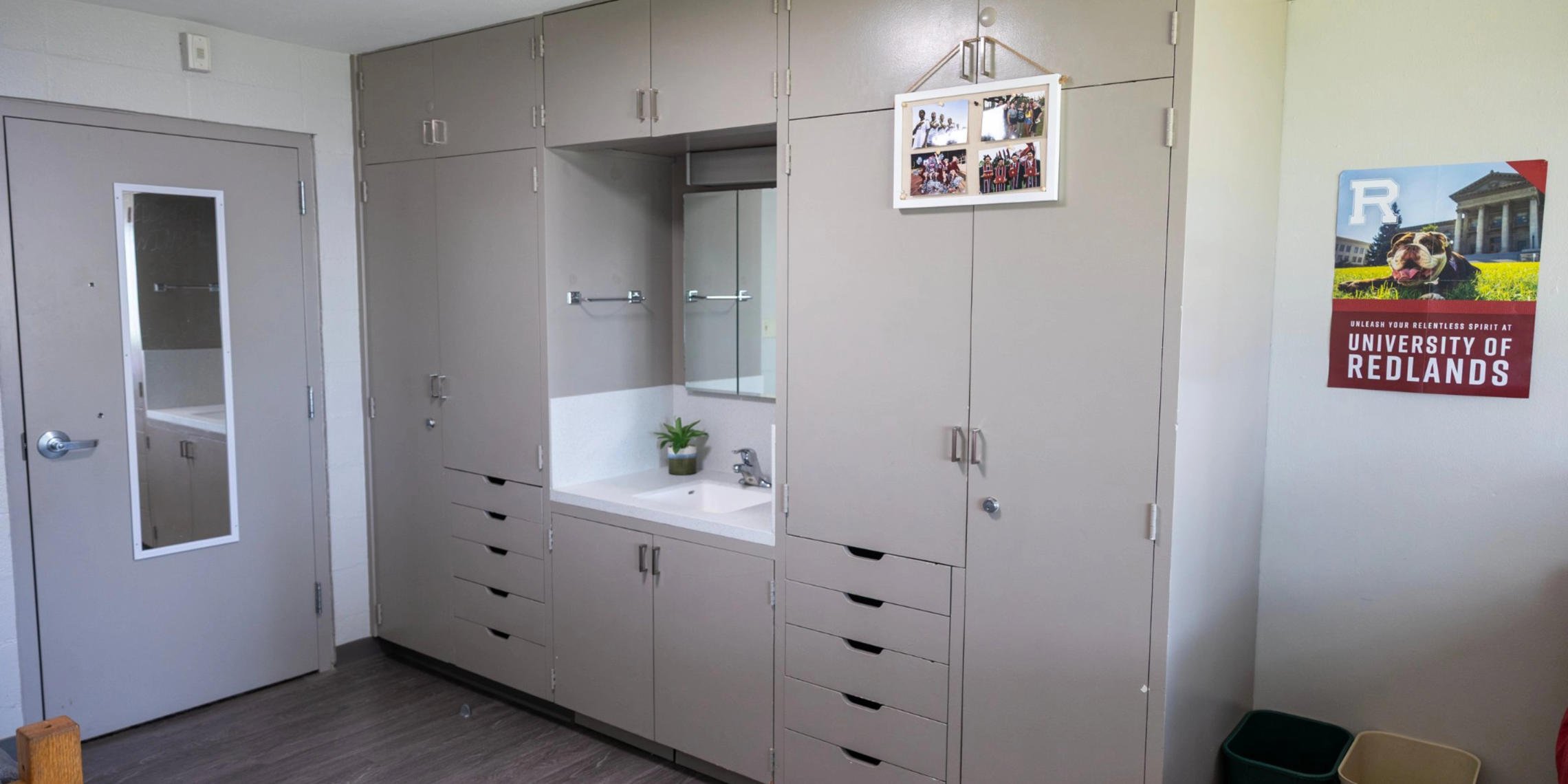a bathroom with cabinets and sink