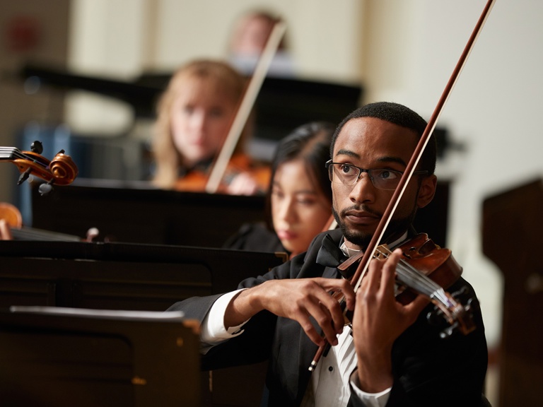 Image card - Violinist playing in orchestra