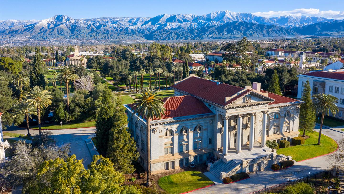 Landscape image of the city of Redlands with the UofR Administration Building on the bottom right.