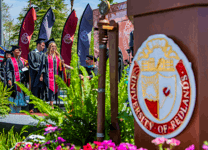 University of Redlands graduates walking by during the commencement ceremony.