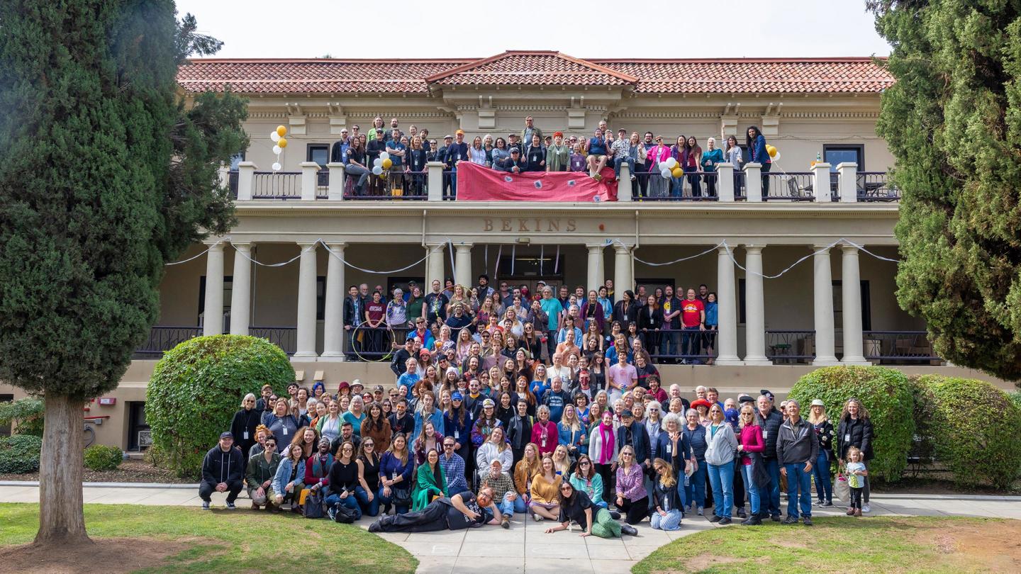 Johnston Students grouped together for photo in front of the Johnston dorm building.