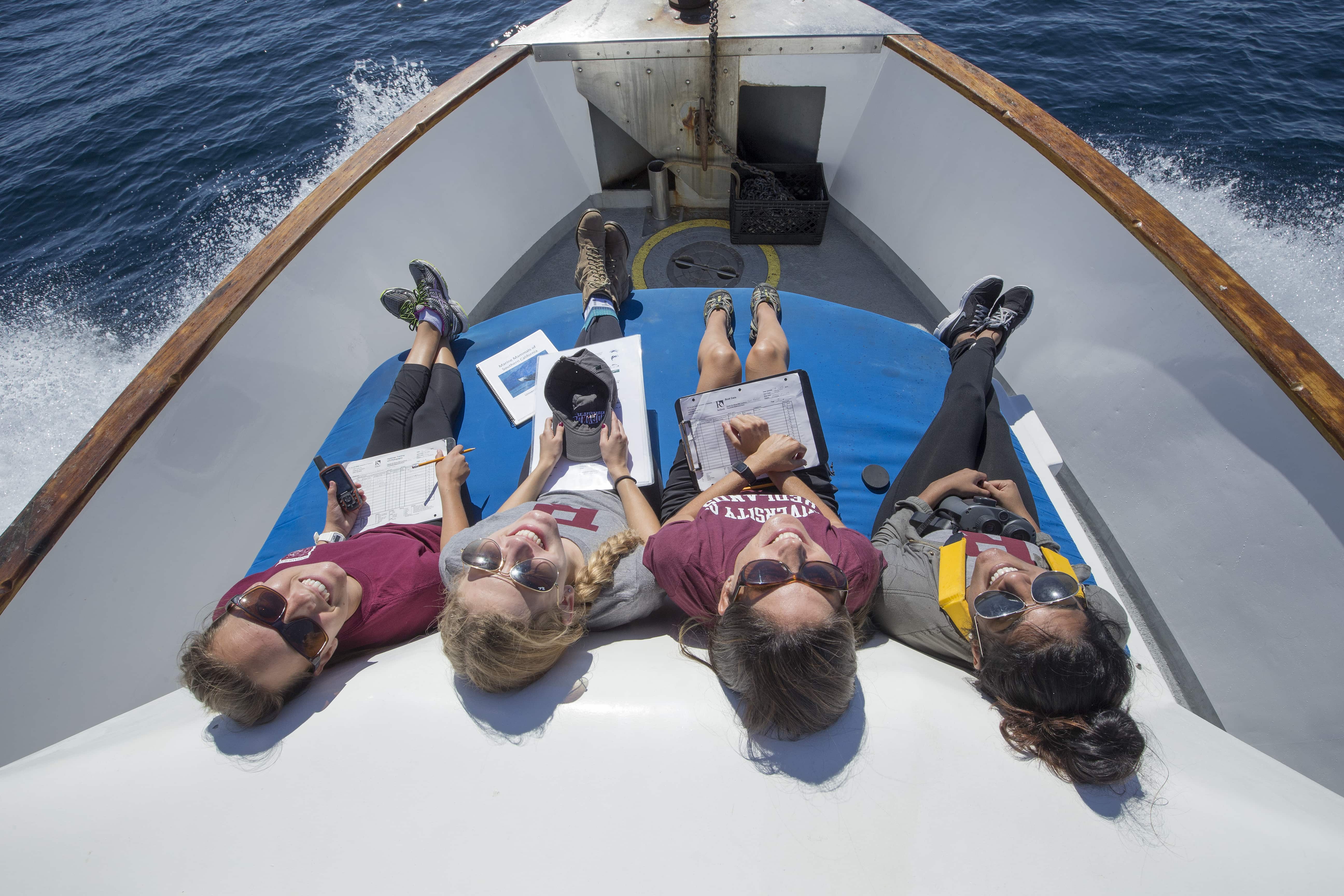 a group of people lying on a boat