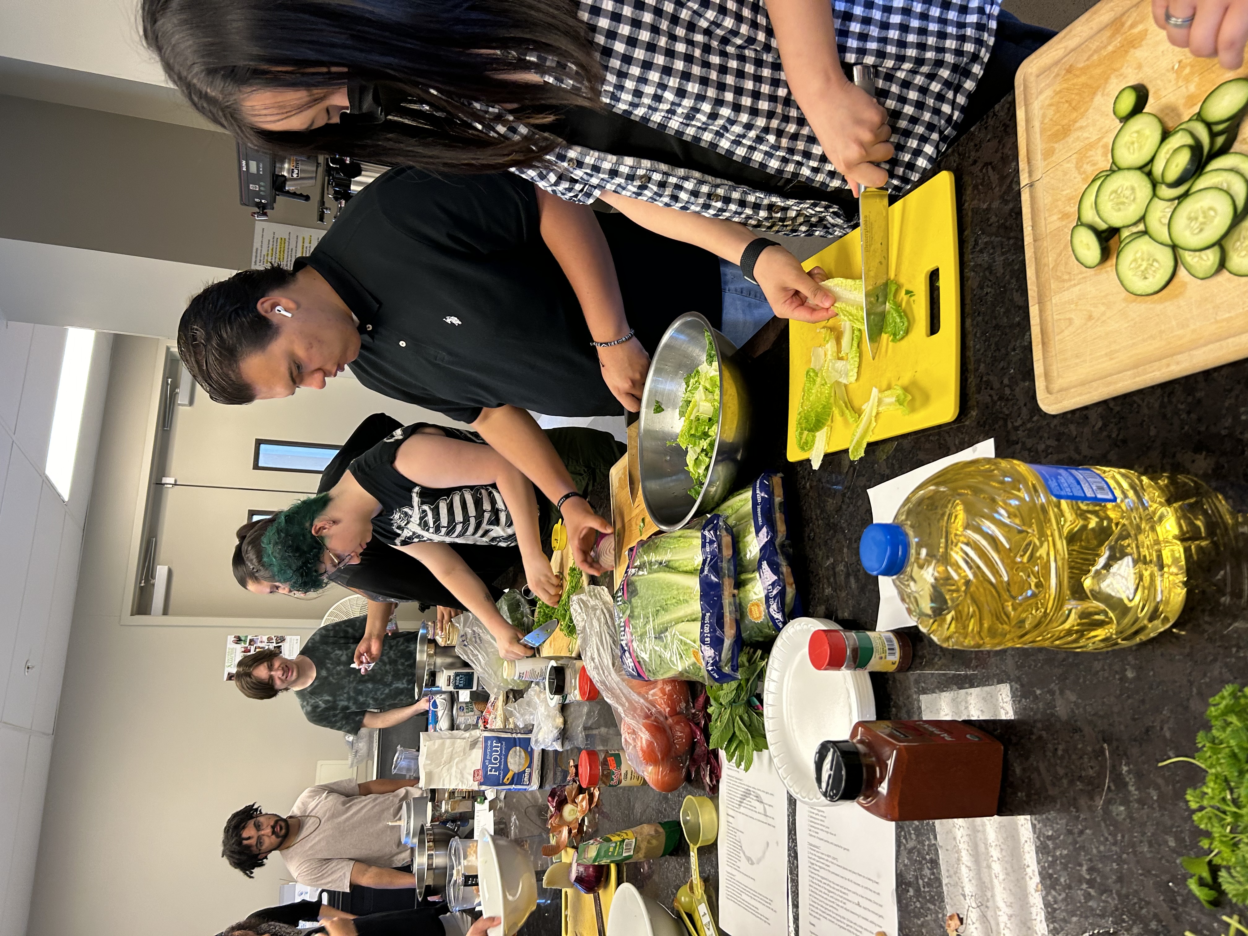 a group of people preparing food